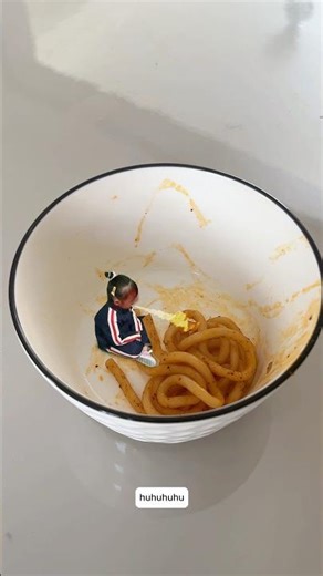 The little girl's first time eating super spicy noodles.