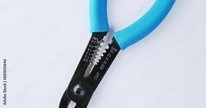 Side cutters for stripping electrical wires, seamless loop. Different divisions for wire thickness. Top view, rotation, demonstration