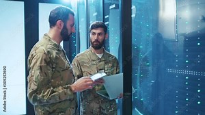 Two serious military men intercepting information in secret network database. Bearded soldiers in uniform walking inside data center monitoring secure system.