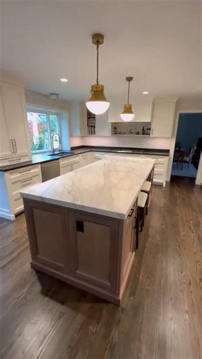 Two-Tone Kitchen Perfection: Marble Island & Bold Black Granite Countertops