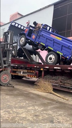 The process of loading the tricycle onto the trailer
