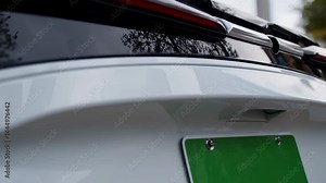 Close-Up of Green License Plate on Electric Vehicle — Clean Energy Identifier and Sustainable Transport Symbol
