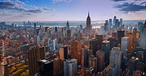 Urban scenery of New York in the light of setting sun. Amazing metropolis from aerial perspective.