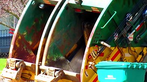 WM Rear Loader Collecting Trash and Packing