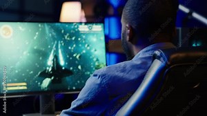 Player at home shooting asteroids in spaceship flying singleplayer game with overlay HUD showing health levels on monitor. Close up of person navigating universe in simulation game on PC