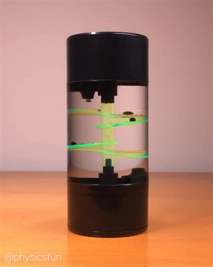 Spiral Oil Drop Timer: a favorite inexpensive physics toy- these drop timers achieve a steady state where the drops form with amazing regularity in terms of both the size of the drop and the spacing between drops. The physics of immiscible liquids, surface tension, viscosity, and gravity combine to produce these interesting patterns. ➡️ Follow the link in my profile for info on where to get this and other amazing items featured here on @physicsfun #physicstoy #viscosity #immiscibleliquids #oildr