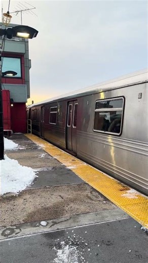 NYC subway N train leaving Astoria-Ditmars station.