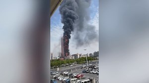 Fire tears through multiple floors of 42-floor skyscraper in Changsha, China