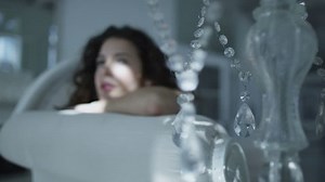 4k / Ultra HD version Beautiful brunette model wearing lingerie relaxing in her boudoir. Shot on RED Epic