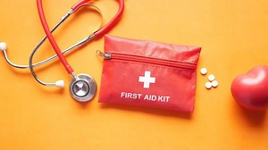 Download First aid kit with stethoscope and red first aid bag for free