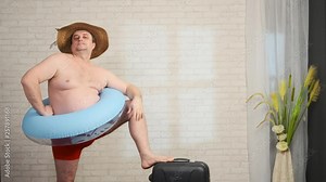 Funny adult man preparing for vacation on a resort. male presents himself on the beach. Stock Video