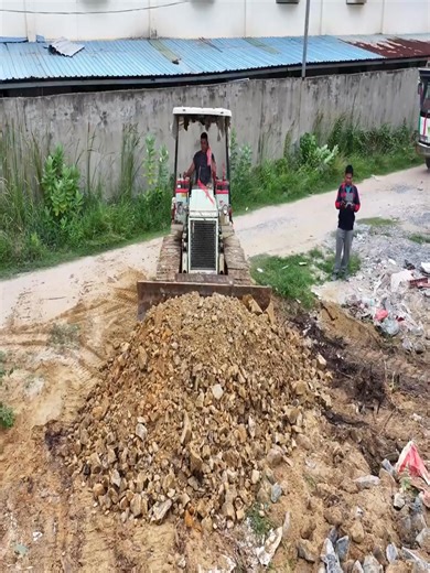 The first small-scale project was executed using a MITSUBISHI BD2F dozer and a 5-ton dump truck | Excavator Cambodia I