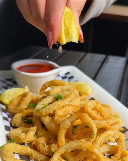 2.4K views · 12 reactions | Get ready to embark on a flavor-filled journey with our irresistible calamari fritti appetizer! 撚✨ Crispy, golden rings, lightly seasoned and served with a marinara dipping sauce. It's a mouthwatering start to an unforgettable meal!  | Maria's Italian Kitchen | Facebook