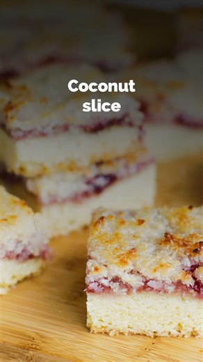 A true Aussie classic, this coconut slice layers a buttery cake base, sticky jam and crunchy coconut topping. Even better, it’s a one-bowl recipe that’s prepped and baked in under an hour. If you'd like this recipe, Google 'BestRecipes Coconut slice'. #bakeryclassics #nostalgicrecipe #childhoodrecipe #aussierecipes | Best Recipes