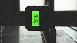 Adjusting table wood saw blade angle using a digital angle finder gauge. Magnetic Protractor Inclinometer Angle Cube Level Box used in woodworking