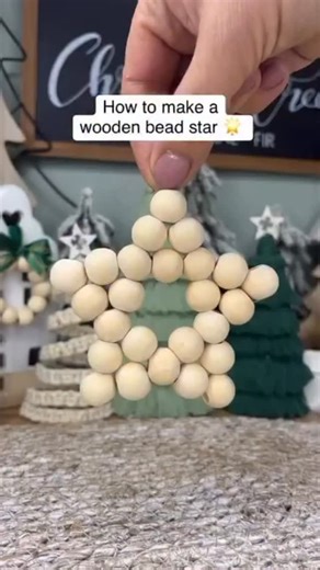 Caroline Fleming on Instagram: "Wooden Bead Star ⭐ You will need 25 wooden beads in total to make this wooden bead star ⭐ I used size 15 mm wooden beads #woodenbeadstar #woodebeads #christmascrafting"