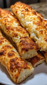 🧀🍞 2-Ingredient Cottage Cheese Breadsticks Warm, soft, and seriously comforting 🤍 High-protein, no yeast, no rise, no stress — these are perfect for busy days, hungry kids, and quick dinners. 🧾 INGREDIENTS: • 1 cup cottage cheese • 1 cup self-rising flour Optional but delicious: • Garlic powder • Italian seasoning • Shredded mozzarella or parmesan 👩‍🍳 DIRECTIONS: Preheat oven to 375°F and line a baking sheet with parchment paper. Mix cottage cheese and self-rising flour until a soft dough 