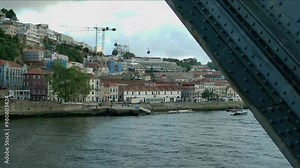 Footage from the bridge in Porto, of the cable cars by the river.