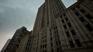 A towering skyscraper against a clear blue sky in New York City
