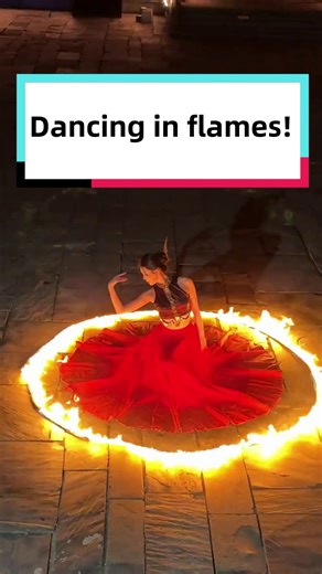 In a fire-skirt dance, every spin sent sparks flying as the performer's grace met the power of the flames—a truly spectacular sight. | Discover China