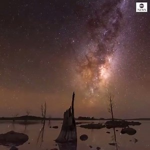 Timelapse footage from Tasmania, Australia, shows the Milky Way spinning in the clear sky as the lake below reflects the shining stars in its still waters. https://abcn.ws/2Xt5yqG | ABC World News Tonight with David Muir