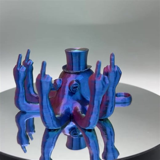 Introducing the ultimate prank gift and desk companion - the Fucktopus - Sir Edition! This 3d printed octopus is not your typical sea creature, as it proudly holds up 5 middle fingers showing off a rebellious side while sporting a top hat. The Fucktopus is 3d printed in PLA using the specialty color of your choice, making it a unique addition to your collection. It's the perfect gift for your friend who loves to push boundaries and break the rules. Sir Middle Finger Octopus comes in 3 sizes. Sma