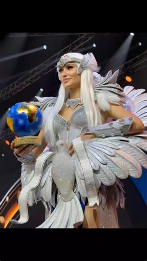 🇺🇦 "Dove of Peace" — Ukraine's national costume at Miss Universe 2025 A dove at the waist spreads its wings, embracing a fragile globe. Ukraine literally holds the world in its hands. Silver = light. Red poppies on the map of Ukraine = the price we pay every single day for this right. This costume is not just beauty. It is a cry from the soul: stop the war. It is a reminder to the world: peace is the duty of every one of us. We fight so that the sky may become quiet again. Анна Филимонова Miss