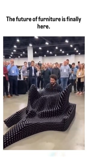 The Social Studio on Instagram: "The post showcases a 10-second video of a transforming modular chair assembled from interlocking black hexagonal plastic modules, demonstrated at a crowded trade show, emphasizing space-saving and customizable furniture innovation. Authored by Rwandan crop scientist Jacques Muhirwa, a curator of viral content, it exploded to 11.7 million views and 9,448 likes within hours, tapping into growing interest in sustainable, adaptable home designs amid urban space const