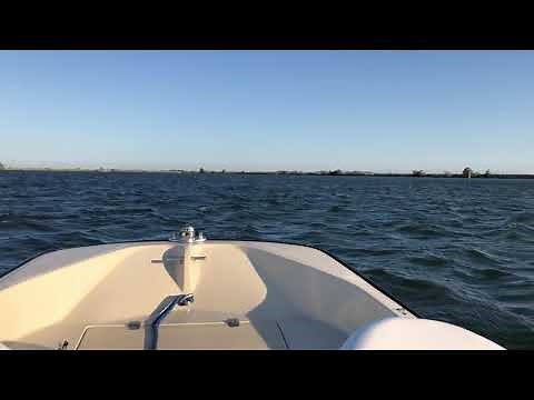 Boston Whaler 13 flying through rough waters