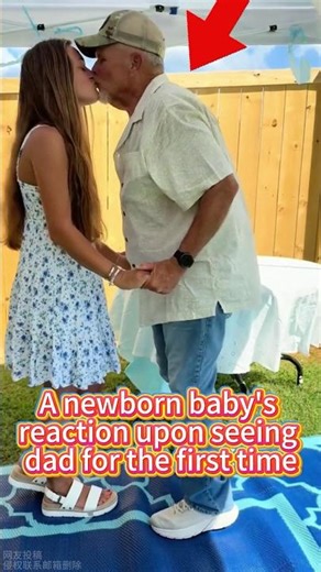 A newborn baby's reaction upon seeing dad for the first time