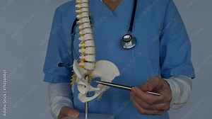 Doctor shows inflammation and pain in intervertebral discs hernia of displaced joints. Spine problem