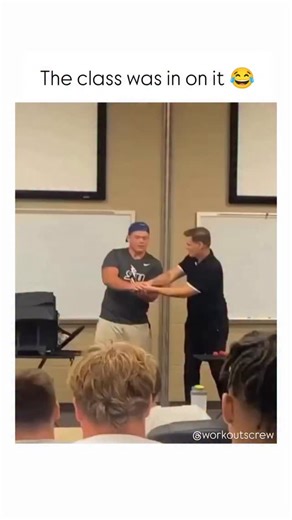 Workouts Crew on Instagram: "The video takes place in a classroom during a lesson. The teacher demonstrates a concept in a practical way using a red ball. He does not speak and explains everything only through actions while a student stands in front of the class and watches closely. During the demonstration, the teacher quietly adds a funny action. The rest of the class understands the joke almost immediately and stays silent, letting the moment play out. The student, however, remains serious an