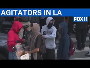 Group hands out riot gear masks during LA anti-ICE protests | FOX 11 LA