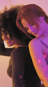 Sensual Women Dancing Together in a Home Party