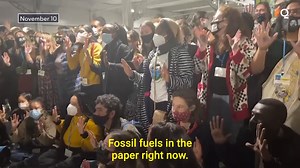 "Fossil fuels in the paper right now." #FridayforFuture activists protest outside the COP26 negotiation room after the COP presidency published a draft on global climate pledges for 2022. https://trib.al/HD17rUR | Bloomberg Originals | Facebook