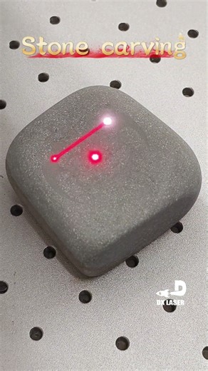 This is a fiber optic 50W laser marking machine that can be used for metal and stone engraving