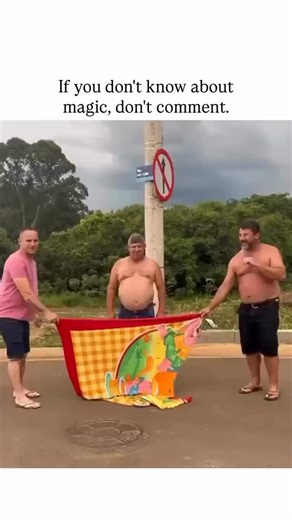 BroWaitListen on Instagram: "This post features a 22-second video of a Brazilian street magic trick where three men hold a colorful beach towel in front of a lamppost, “disappearing” the middle man while his protruding belly creates a comical “pregnant lamppost” illusion, captioned sarcastically to deter uninformed comments. - Posted by @Rainmaker1973, known for curating awe-inspiring content on science and the unusual, the video exploded in popularity with 41k likes and 2.7 million views within