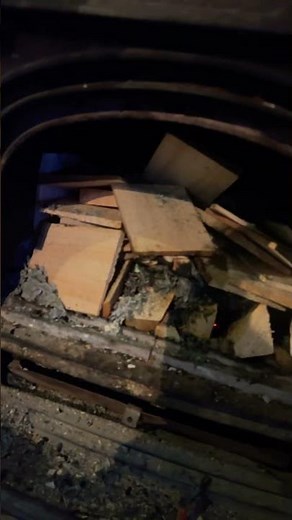 Starting open fire using newspaper as draw to start.￼