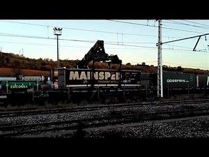 Reach stacker loading a freight train in Granollers Centre, Barcelona