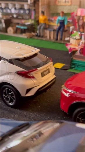 Exploring Miniature Car Models in a Detailed Workshop