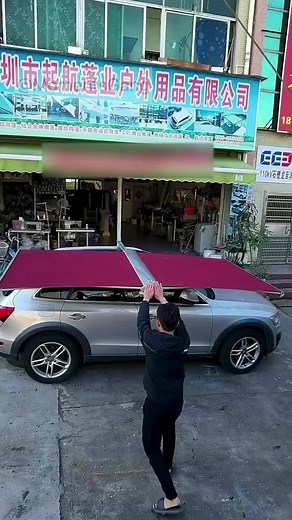 Essential Car Accessories: Unfolding a Red Awning