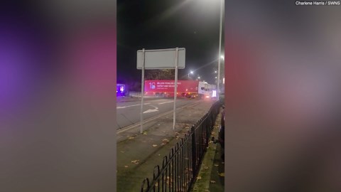 Shocking moment bulldozer ploughs through lorry as stunned onlookers watch in shock