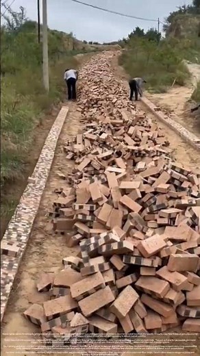 The process of paving a road directly with bricks without using concrete