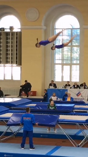 Synchronized Gymnastics Routine on Blue Mat