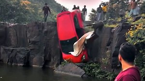 Thanks to the quick actions of people nearby, no casualties were reported after this car rolled off the edge of a waterfall. | USA TODAY Video
