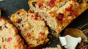 Trini Sweet Bread ( Eggless ) Learn how to make step by step the easiest and best sweet bread ever! 1 1/2 cups all purpose flour 1/2 cup sugar - use how much you will like 1 1/4 tsp baking powder 1/8 tsp baking soda 1 cup freshly grated coconut or sweet shredded 1/4 cup raisins 1/4 cup cranberries 1/4 cup mixed peel 1/2 tsp cinnamon 1/4 tsp nutmeg 1 tsp Herrera's cherry essence 1 cup evaporated milk / Coconut milk 3/4 cup butter at room temp https://www.paypal.me/TCWN | Trini cooking with Natash