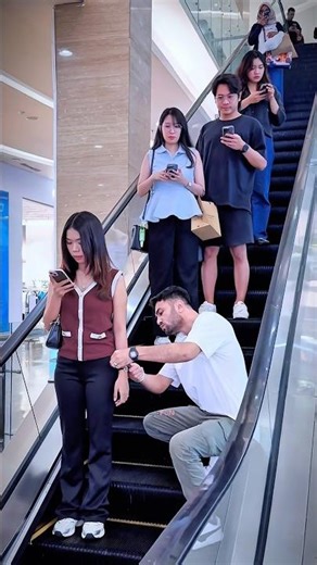 Funny handcuffs prank on escalator