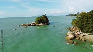 Batu Ferringhi, Malaysia: Aerial drone footage of the coast and beaches of the batu ferringhi area in the Penang island in Malaysia in Southeast Asia. Shot with a forward motion