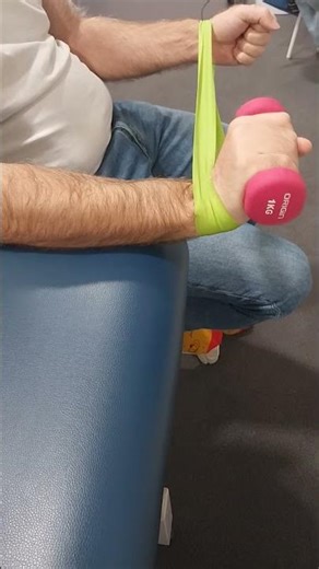 Wrist extension with band and weight