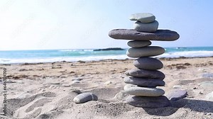 Stacked stones on an Irish beach showing zen and balance before the stack collapses